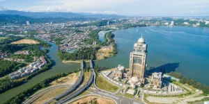 Aerial view of Kota Kinabalu city centre and surrounding landscape- feature image for Kota Kinabalu Travel Guide Blog